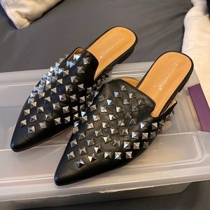 Studded mules.